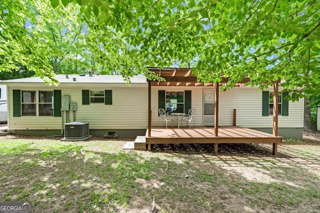 82 Dogwood Ct, Sparta, GA 31087 - back of property featuring central air condition unit, crawl space, a deck, and a pergola
