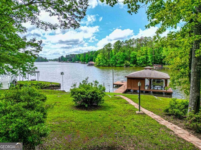 82 Dogwood Ct, Sparta, GA 31087 - water view with a boat dock and a wooded view