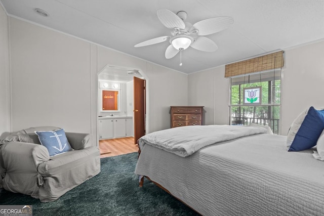 82 Dogwood Ct, Sparta, GA 31087 - carpeted bedroom with ceiling fan, ensuite bathroom, and ornamental molding