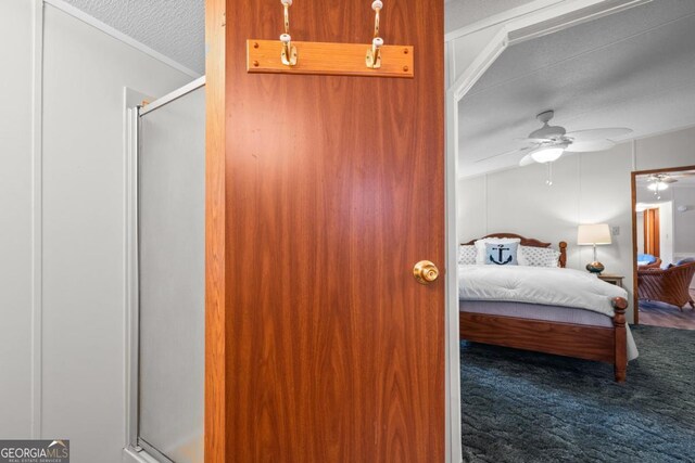 82 Dogwood Ct, Sparta, GA 31087 - bedroom with carpet floors, a textured ceiling, and ceiling fan