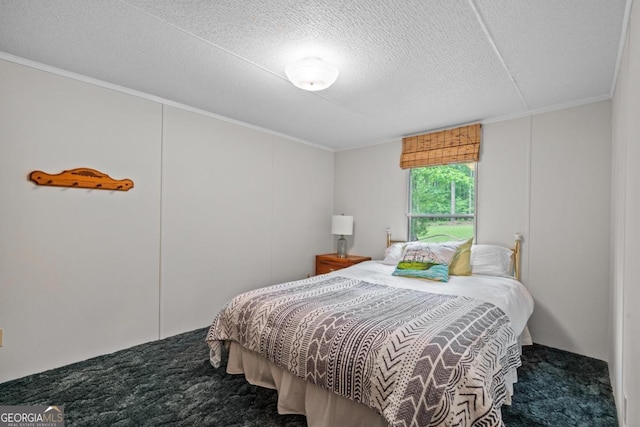 82 Dogwood Ct, Sparta, GA 31087 - bedroom featuring crown molding, carpet flooring, and a textured ceiling
