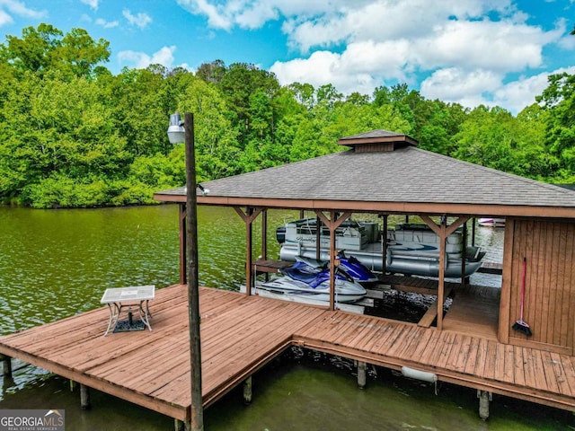 82 Dogwood Ct, Sparta, GA 31087 - dock area with a view of trees, boat lift, and a water view