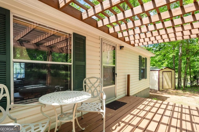 82 Dogwood Ct, Sparta, GA 31087 - wooden deck with a pergola, an outbuilding, and a storage shed