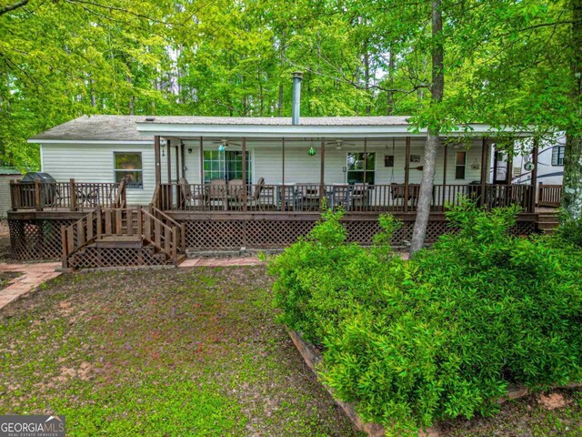 82 Dogwood Ct, Sparta, GA 31087 - rear view of house with a porch and stairs