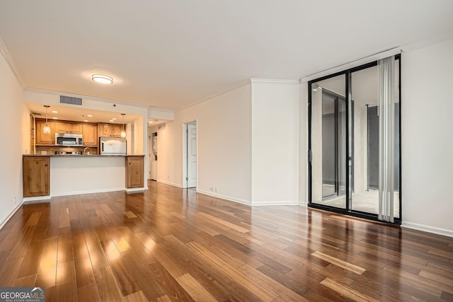 3481 Lakeside Dr NE Unit 1504, Atlanta, GA 30326 - unfurnished living room featuring baseboards, ornamental molding, wood finished floors, and visible vents