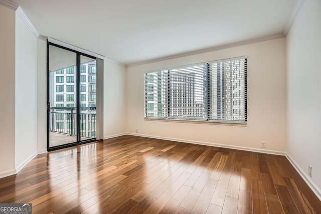 3481 Lakeside Dr NE Unit 1504, Atlanta, GA 30326 - empty room featuring baseboards, ornamental molding, and wood finished floors