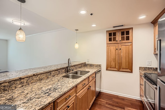 3481 Lakeside Dr NE Unit 1504, Atlanta, GA 30326 - kitchen with light stone counters, a sink, brown cabinetry, dark wood finished floors, and appliances with stainless steel finishes
