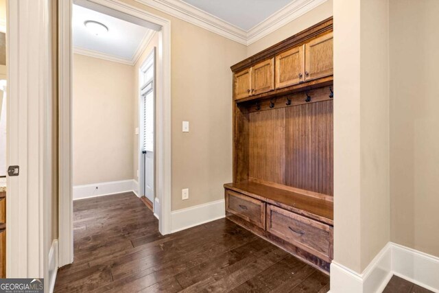 mudroom featuring baseboards, ornamental molding, and dark wood-style flooring