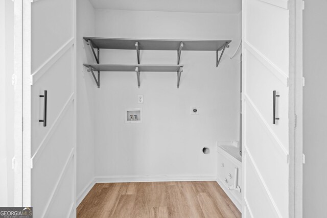 24 Hamilton Dr, Jefferson, GA 30549 - washroom with hookup for an electric dryer, baseboards, light wood-style floors, hookup for a washing machine, and laundry area
