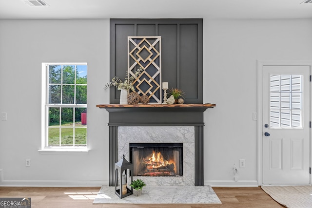 24 Hamilton Dr, Jefferson, GA 30549 - room details with a high end fireplace, wood finished floors, visible vents, and baseboards