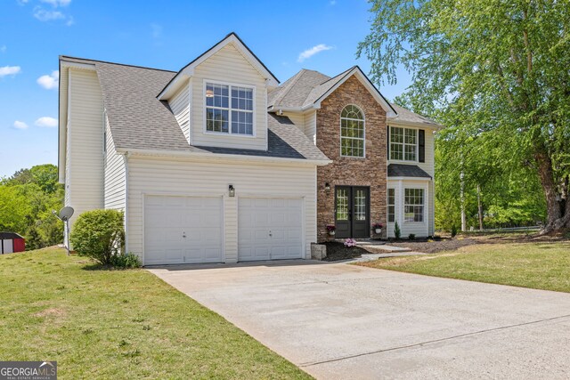 24 Hamilton Dr, Jefferson, GA 30549 - view of front of home featuring a shingled roof, driveway, and a front yard