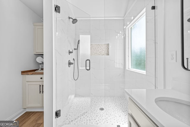 24 Hamilton Dr, Jefferson, GA 30549 - bathroom featuring wood finished floors, vanity, and a marble finish shower