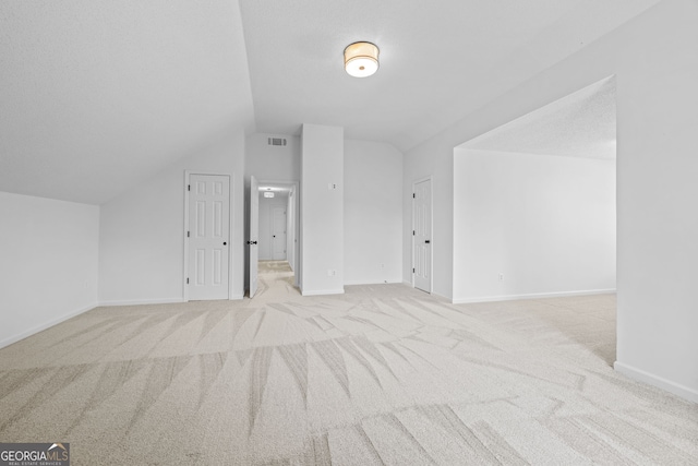 24 Hamilton Dr, Jefferson, GA 30549 - bonus room featuring baseboards, lofted ceiling, visible vents, and carpet