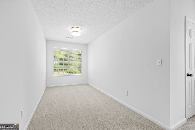 24 Hamilton Dr, Jefferson, GA 30549 - carpeted spare room featuring visible vents, baseboards, and a textured ceiling