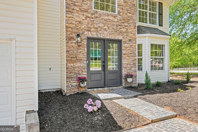 24 Hamilton Dr, Jefferson, GA 30549 - doorway to property with french doors and stone siding