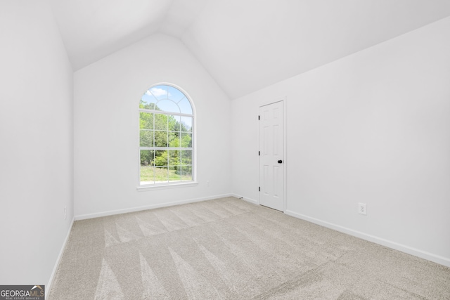 24 Hamilton Dr, Jefferson, GA 30549 - carpeted empty room featuring vaulted ceiling and baseboards
