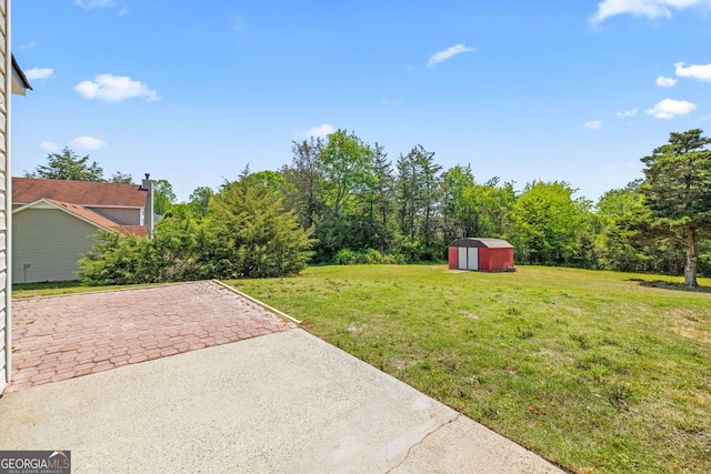 24 Hamilton Dr, Jefferson, GA 30549 - view of yard featuring a patio area, an outdoor structure, and a shed