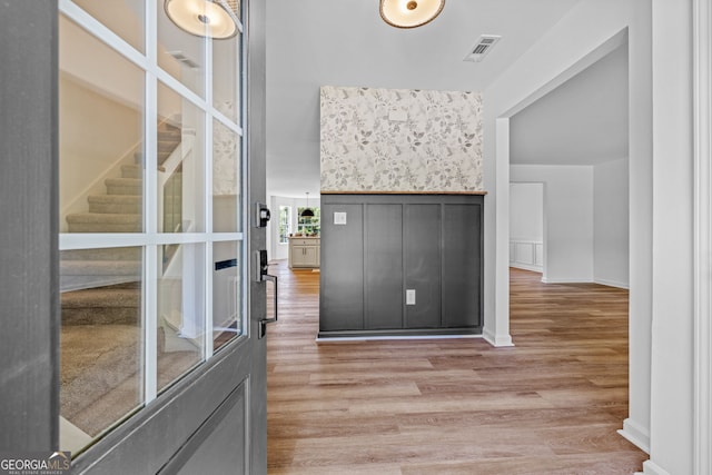 24 Hamilton Dr, Jefferson, GA 30549 - hall featuring light wood finished floors, visible vents, and stairs