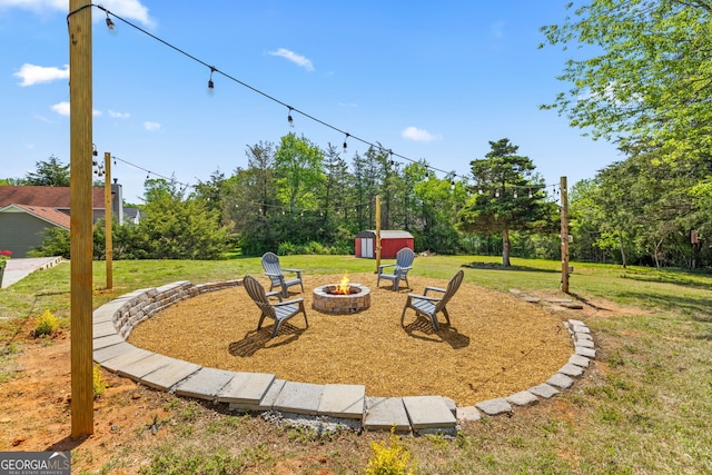 24 Hamilton Dr, Jefferson, GA 30549 - view of yard featuring an outdoor fire pit, an outdoor structure, and a storage shed