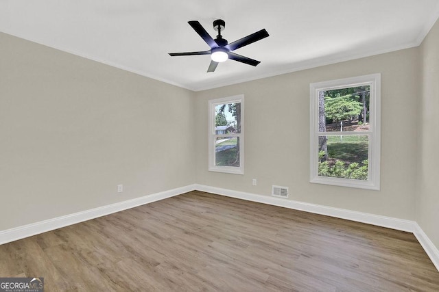 486 Edward Ct, Marietta, GA 30066 - unfurnished room with plenty of natural light, crown molding, wood finished floors, and baseboards