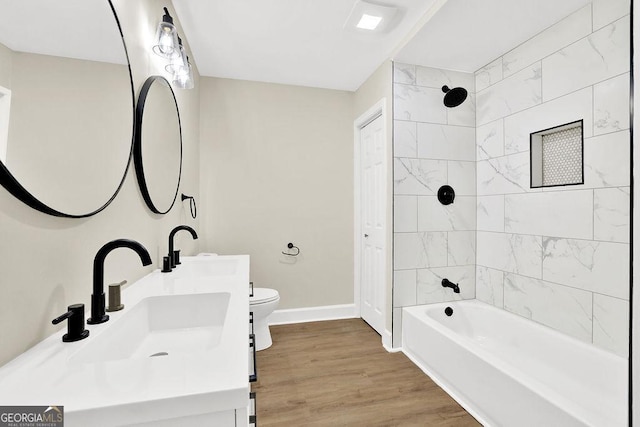 486 Edward Ct, Marietta, GA 30066 - bathroom with toilet, baseboards, bathing tub / shower combination, wood finished floors, and double vanity