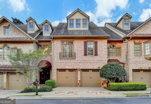 6273 Clapham Ln, Johns Creek, GA 30097 - townhome / multi-family property featuring brick siding, driveway, and a garage