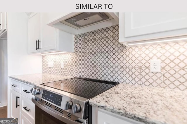 104 Reedy Ct, Perry, GA 31069 - kitchen with stainless steel range with electric stovetop, range hood, tasteful backsplash, and light stone countertops