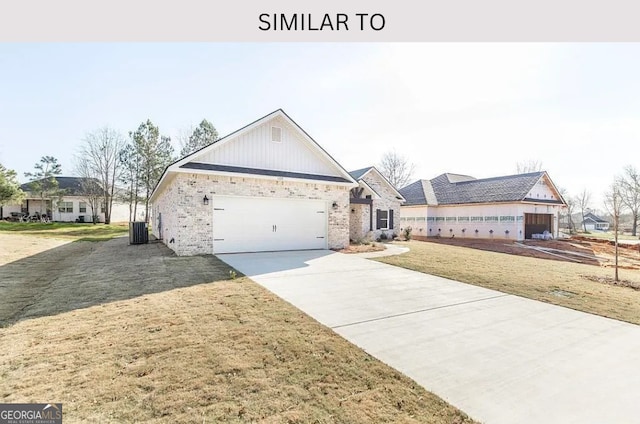 104 Reedy Ct, Perry, GA 31069 - view of front of house with an attached garage, driveway, a front lawn, and brick siding