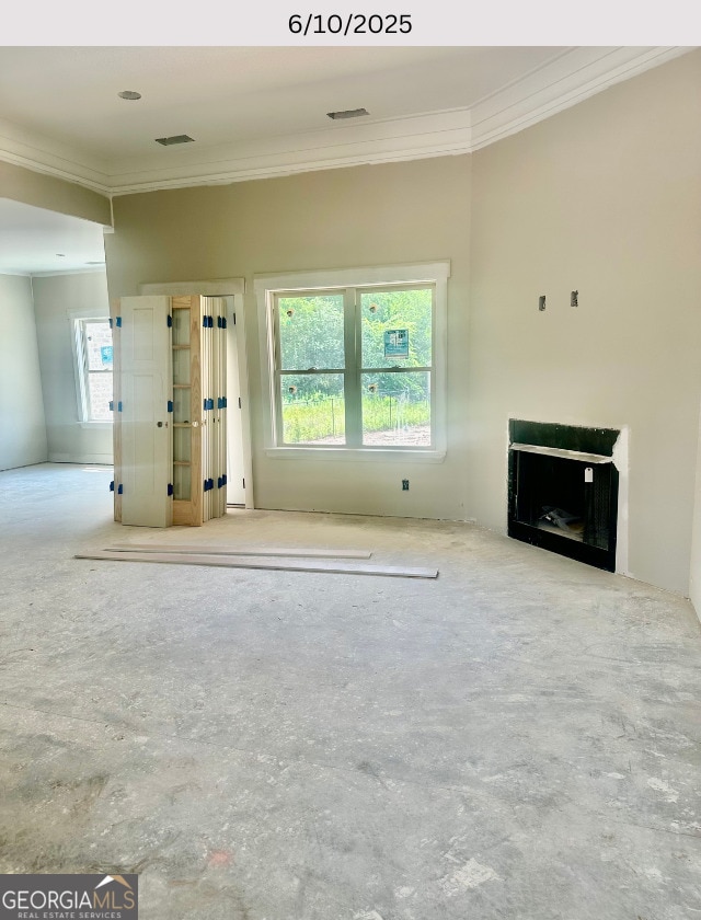 104 Reedy Ct, Perry, GA 31069 - unfurnished living room featuring crown molding and a fireplace