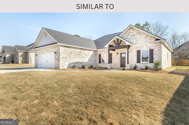 104 Reedy Ct, Perry, GA 31069 - view of front facade with a front lawn, brick siding, a garage, and driveway