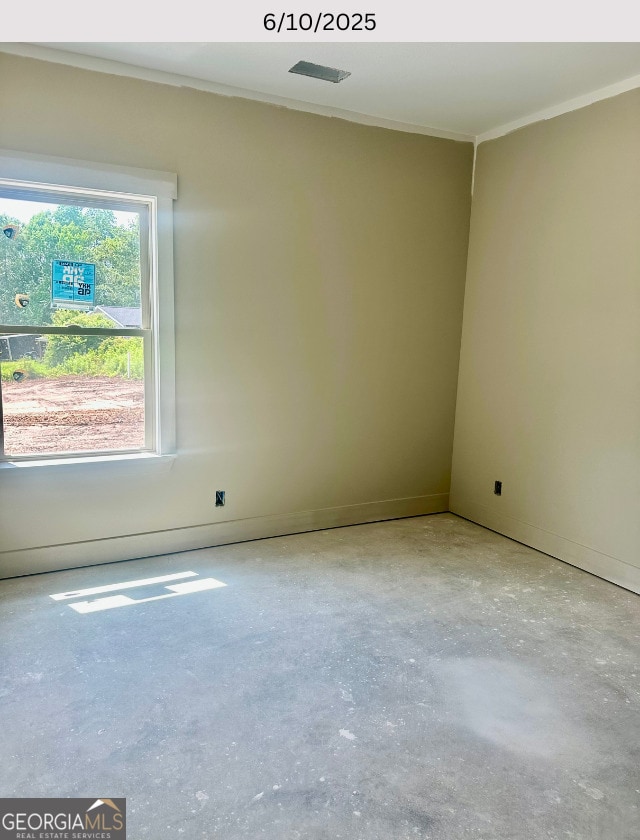 104 Reedy Ct, Perry, GA 31069 - spare room featuring ornamental molding and concrete flooring