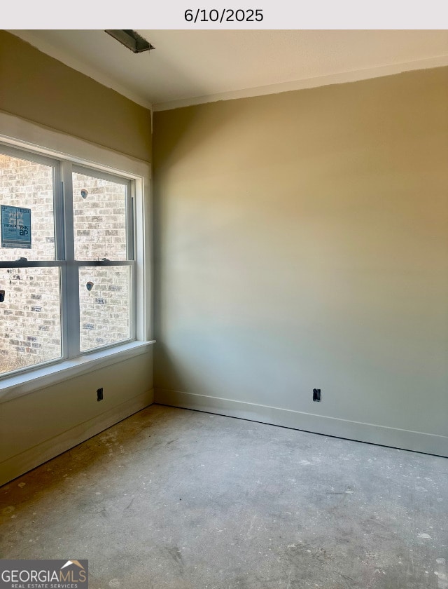 104 Reedy Ct, Perry, GA 31069 - empty room featuring concrete flooring and ornamental molding