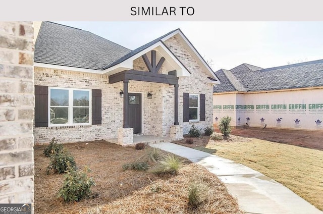 104 Reedy Ct, Perry, GA 31069 - view of front of home featuring brick siding and roof with shingles