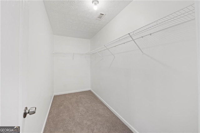 720 Georgetown Ln, Jonesboro, GA 30236 - walk in closet featuring carpet floors and visible vents