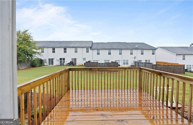 720 Georgetown Ln, Jonesboro, GA 30236 - deck featuring a lawn, a fenced backyard, and a residential view
