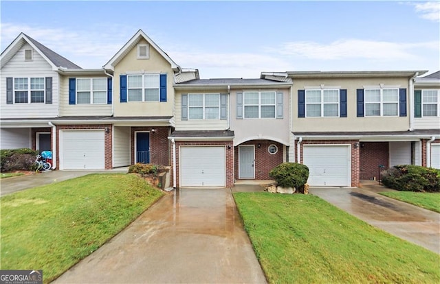 720 Georgetown Ln, Jonesboro, GA 30236 - multi unit property with driveway, brick siding, a front yard, and a garage