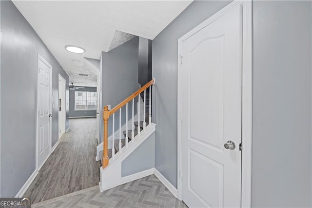 720 Georgetown Ln, Jonesboro, GA 30236 - staircase with parquet flooring and baseboards