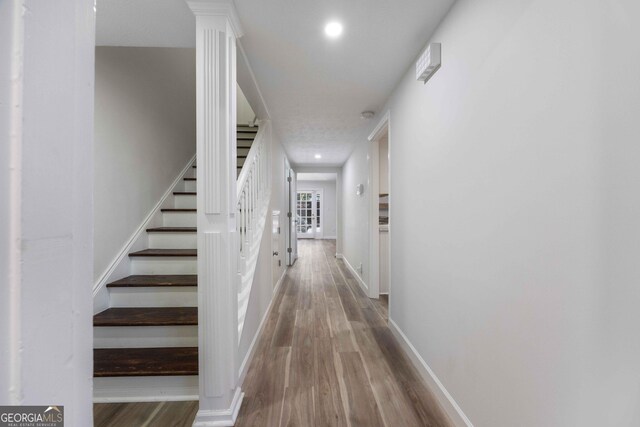6101 River Rd Apt 20, Columbus, GA 31904 - hallway featuring recessed lighting, wood finished floors, stairs, and baseboards