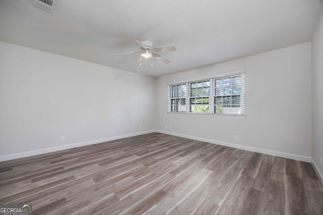 6101 River Rd Apt 20, Columbus, GA 31904 - empty room with baseboards, wood finished floors, visible vents, and ceiling fan