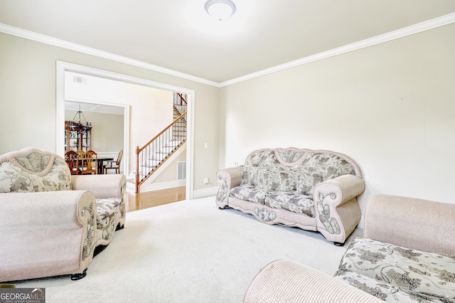 living room with baseboards, carpet, stairway, and crown molding