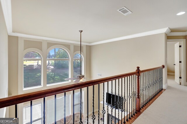 hallway with recessed lighting, carpet floors, visible vents, and ornamental molding