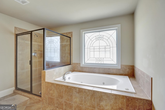 full bathroom featuring visible vents, a whirlpool tub, and a shower stall