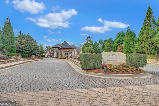view of front of property featuring a gazebo, a standing seam roof, and metal roof