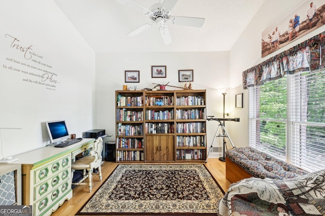 office area featuring light wood finished floors and a ceiling fan