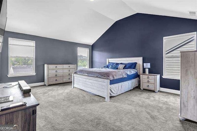 5015 Jack Dr, Decatur, GA 30035 - bedroom with vaulted ceiling, baseboards, carpet floors, and multiple windows