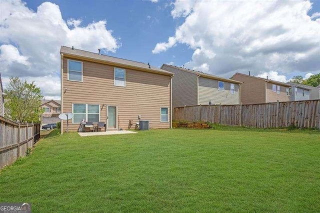 5015 Jack Dr, Decatur, GA 30035 - back of property featuring a patio area, a lawn, and a fenced backyard
