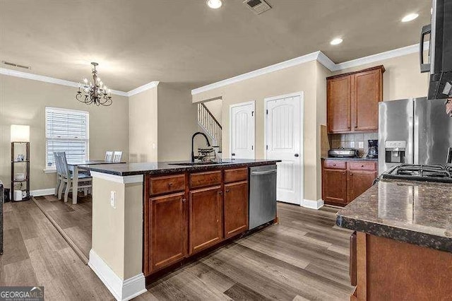5015 Jack Dr, Decatur, GA 30035 - kitchen with a sink, stainless steel appliances, a notable chandelier, dark wood-type flooring, and visible vents