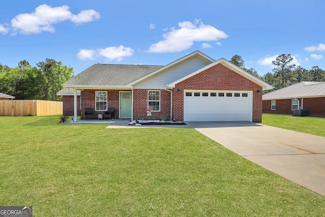 256 Deloach Rd NE, Ludowici, GA 31316 - ranch-style home with fence, driveway, brick siding, a front yard, and a garage