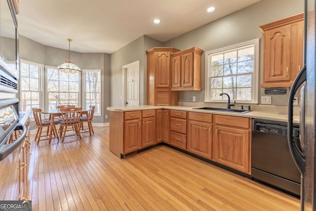 160 Keese Ln, Fair Play, SC 29643 - kitchen with light wood finished floors, a peninsula, a sink, black dishwasher, and light countertops