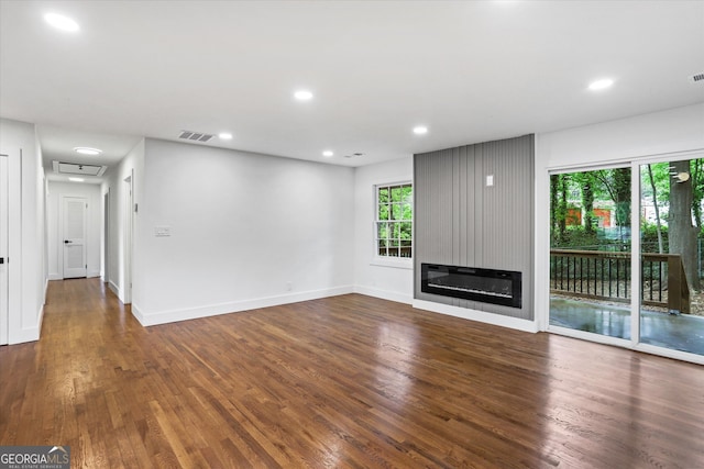 800 Kiowa Dr NE, Marietta, GA 30060 - unfurnished living room featuring wood finished floors, a large fireplace, recessed lighting, and baseboards